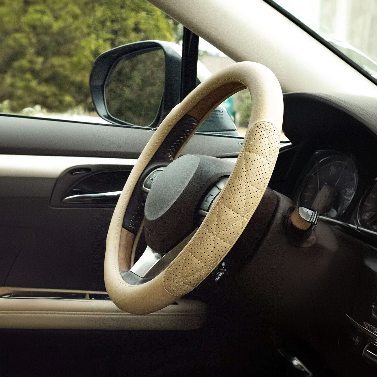 Close-up detail of a beige steering wheel cover