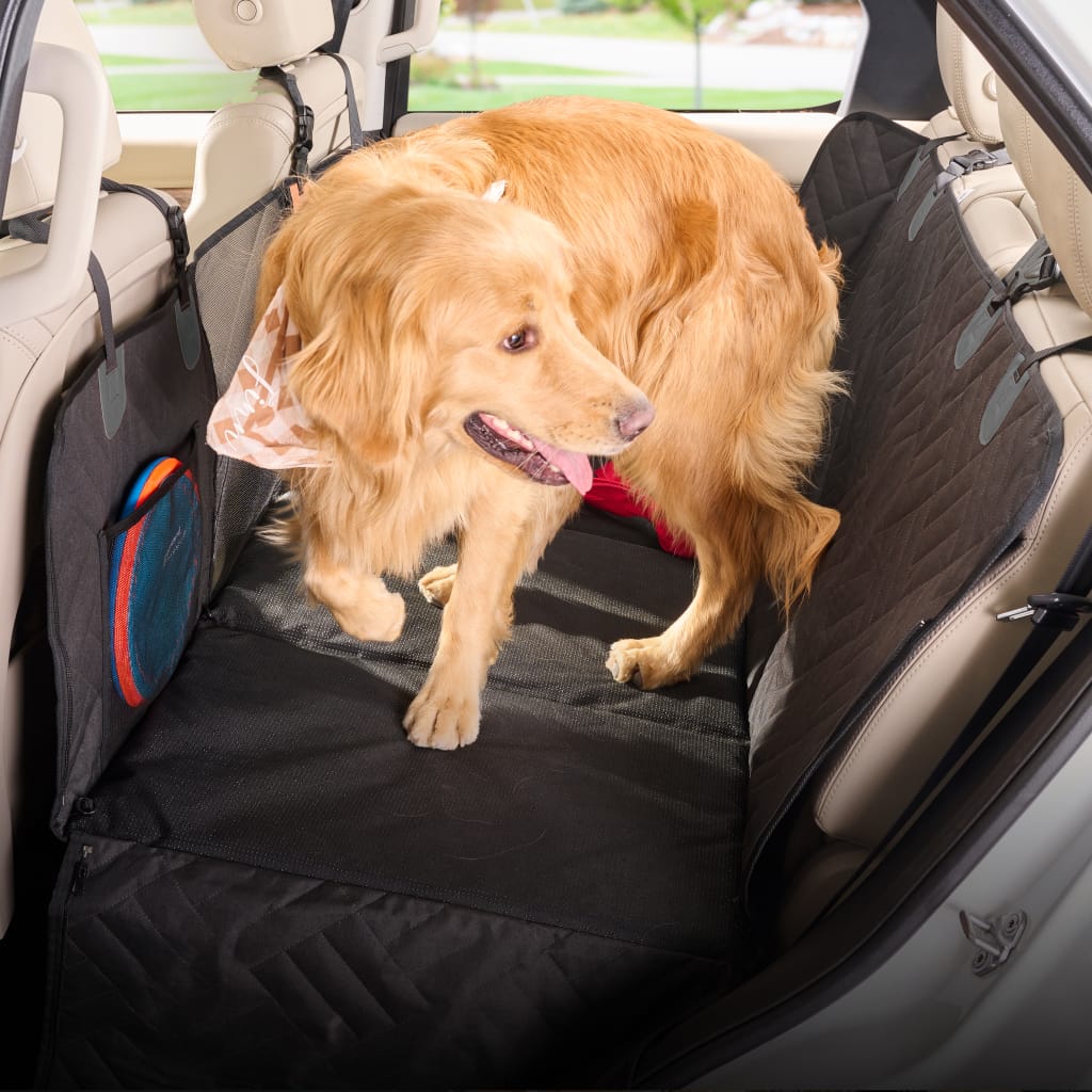 PetSuite hard-bottom dog seat protector fitted across a vehicle back seat