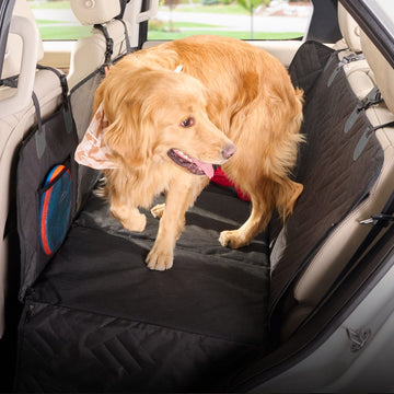 PetSuite hard-bottom dog seat protector fitted across a vehicle back seat