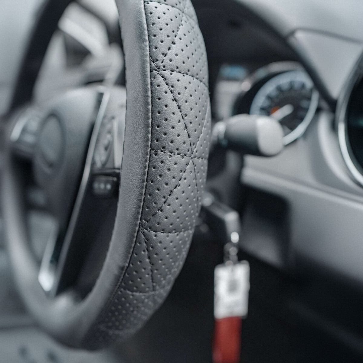 Close-up detail of the steering wheel cover material