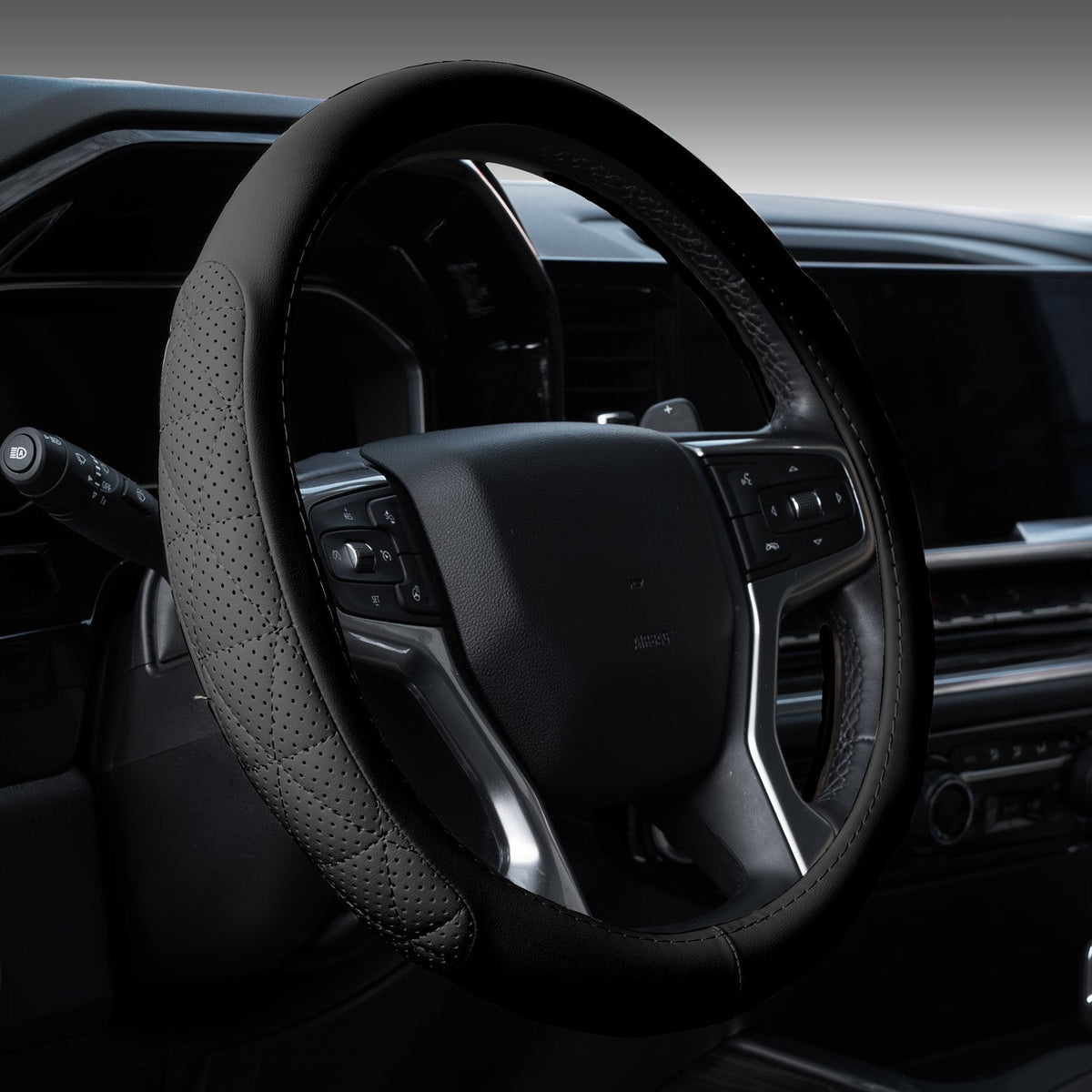 Solid black eco-leather steering wheel cover fitted in a car