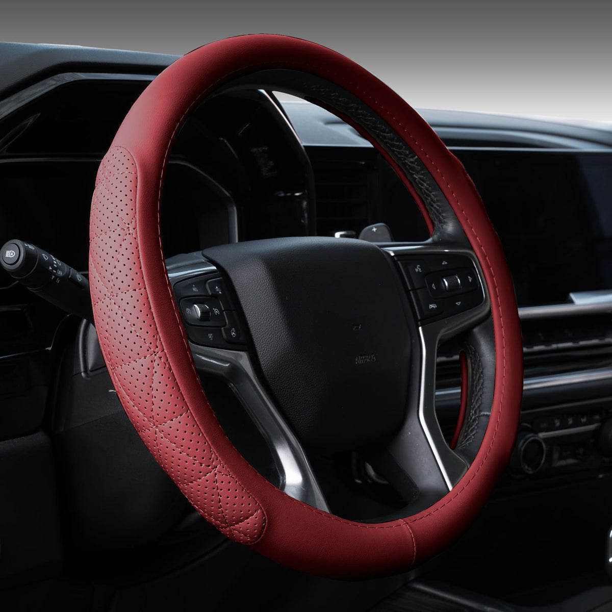 Solid wine red eco-leather steering wheel cover fitted in a car